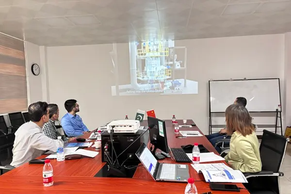 Cronus Machinery technical staff introducing the CRRM1850 Raymond Mill to Pakistani customers in the R&D center