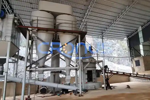Why is high-chromium cast iron used for the liner of a Raymond mill?